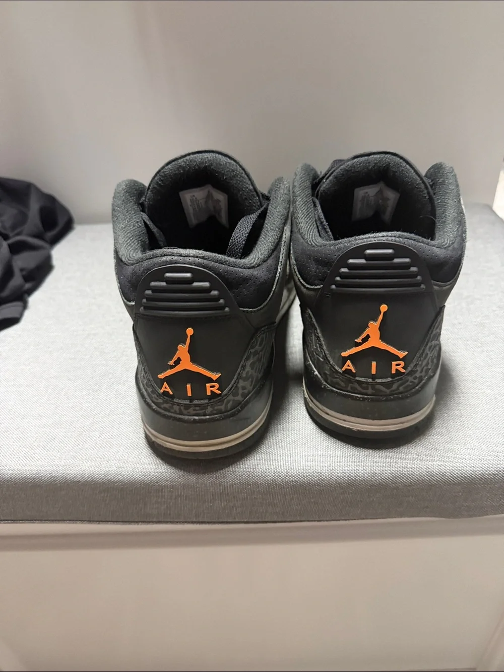 Retro 3 Jordan Men’s Black Sneakers with Orange Jumpman Accents